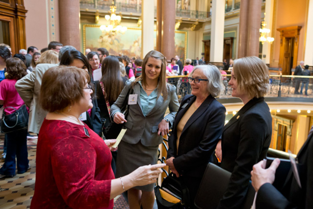 Representative Marti Anderson, left chats with first year law student Heather Jackson, from left, Law School Associate Dean Linda McGuire, and first year law student Kelli Lang in the Capiol Building.
