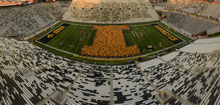 first-year students form a "block I" on the Kinnick Stadium field