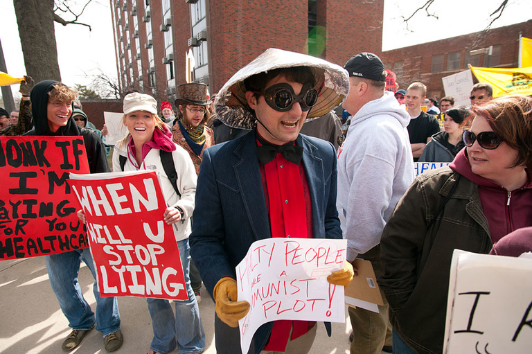 Demonstrator with hat.