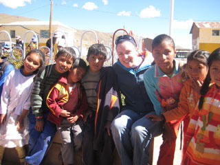 study abroad student with youth in Peru