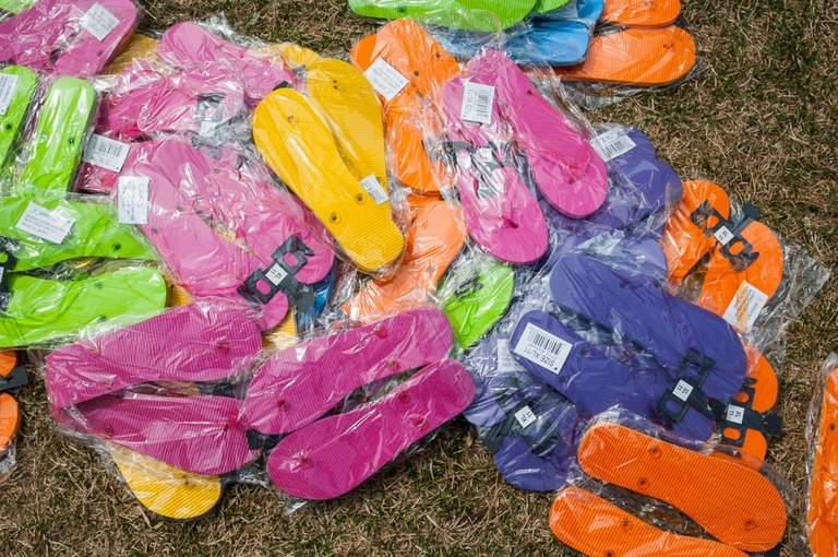 Large pile of flip flops