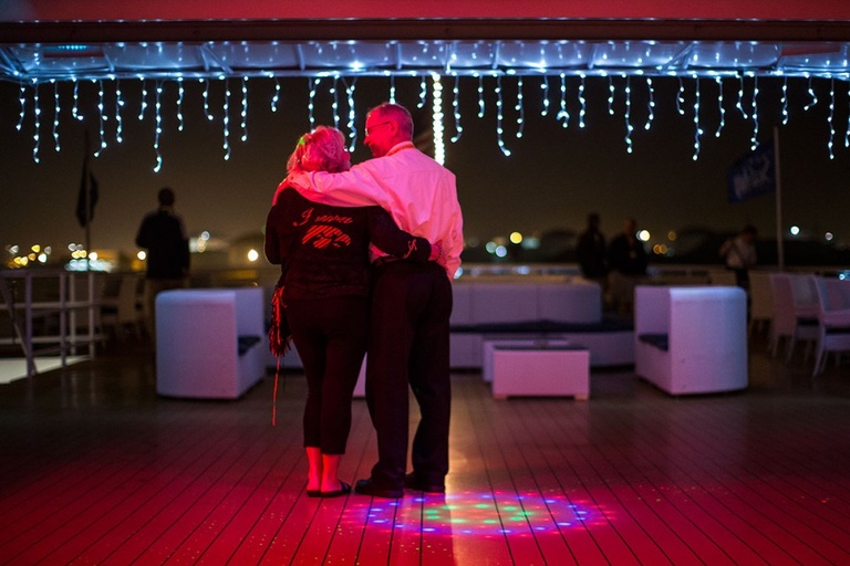 Couple dancing on a boat.