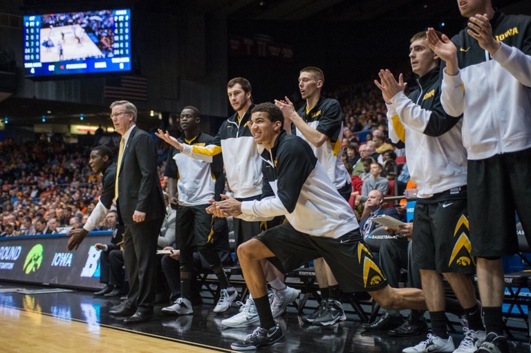 Iowa bench celebrating after a made shot.