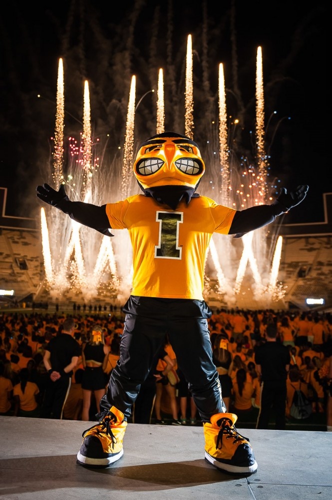Mascot Herky with fireworks in the background.