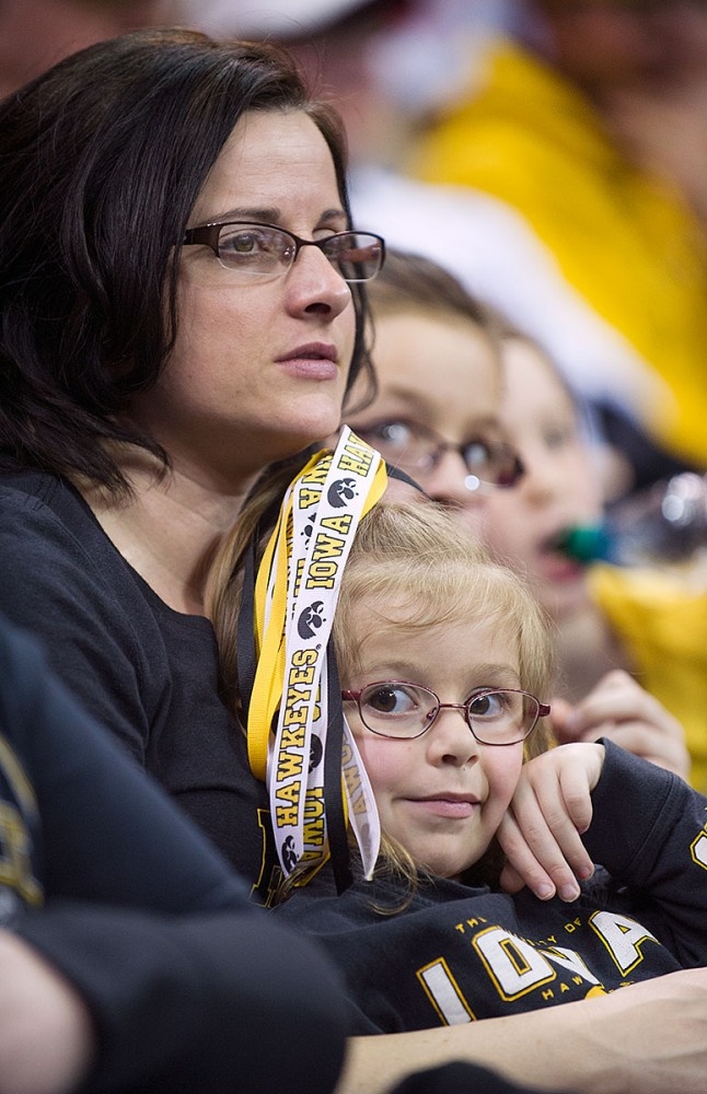 A mother and young child in the stands.