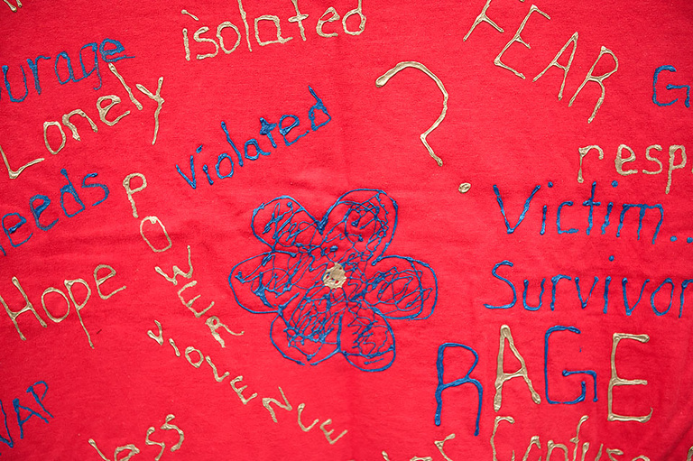 Detail of Clothesline Project shirt.