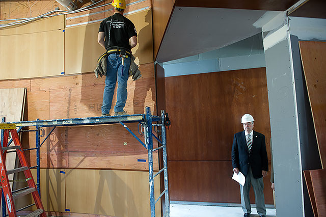 Governor Branstad checks up on a room still under construction.
