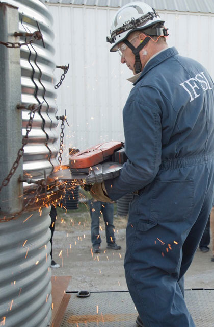 A special saw blade cuts through grain bin panels during a rescue demonstration