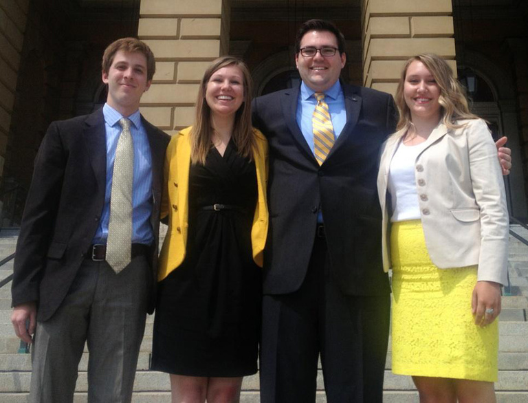 Photo of Jack Cumming (undergrad Vice President), Katherine Valde (undergrad president), Ben Gillig (president of the graduate and professional student body), and Carter Bell (undergrad governmental relations director). 