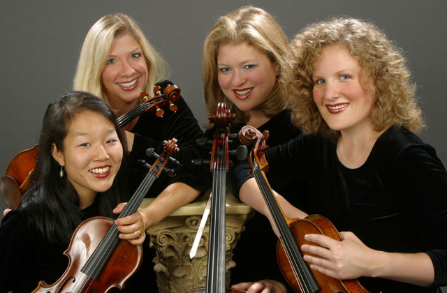 members of the cavani string quartet with their instruments