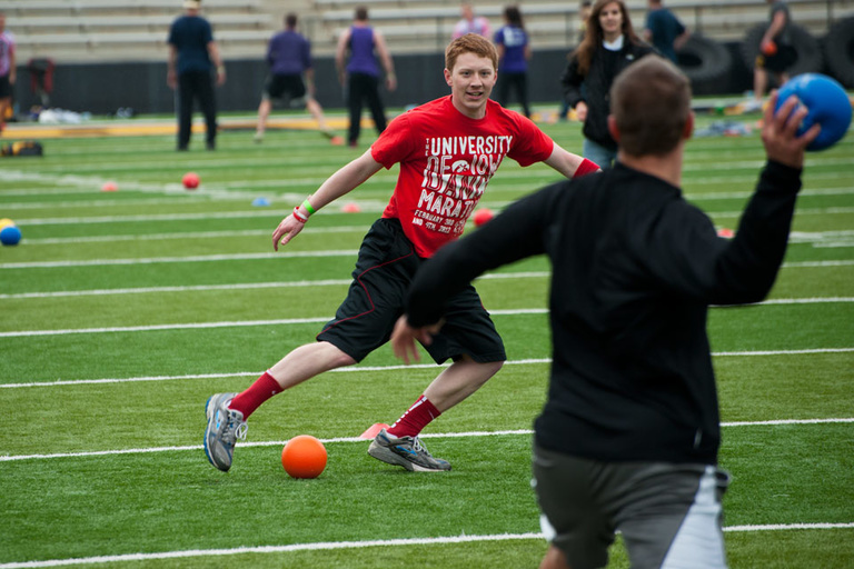 Students play dodgeball at Kinnick Stadium
