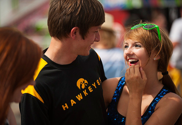 Guy wearing Hawkeye shirt with young woman.