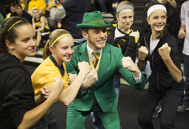 Iowa fans pose with the Notre Dame mascot.