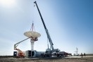 A large crane drops the NPOL antenna into place. The NPOL radar is located in eastern Iowa near Waterloo for the IFloodS campaign (May 1-June 15). Photo by Aneta Goska, Iowa Flood Center.