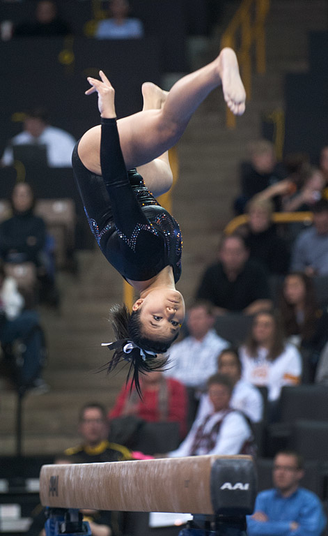 Iowa gymnast competing on the beam.