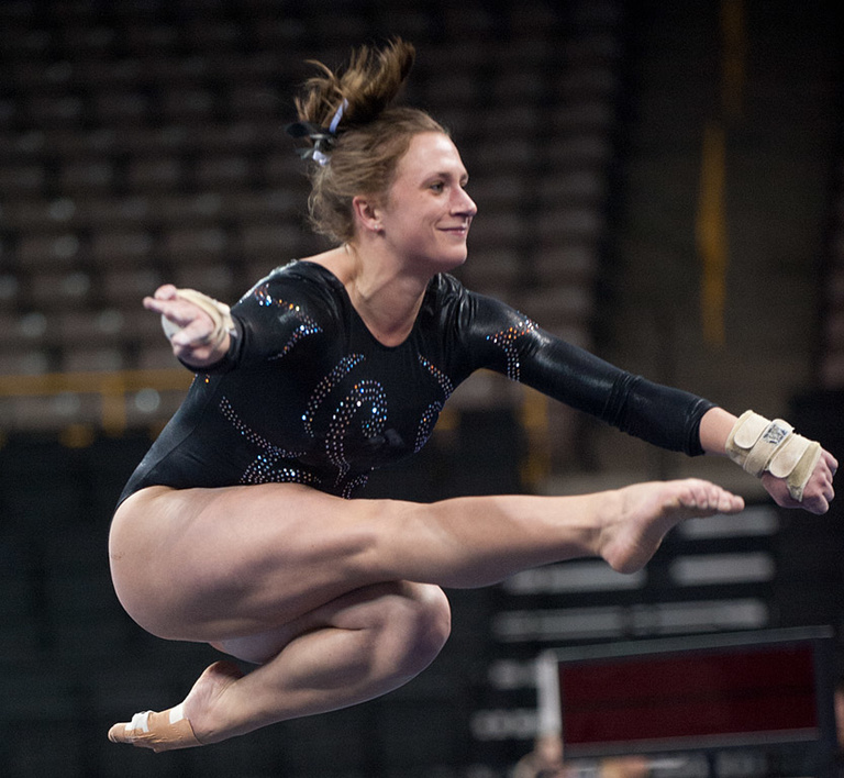 Iowa gymnast competing in the floor exercise.