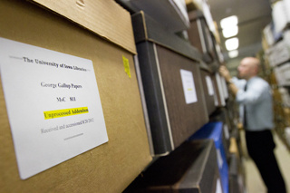 labeled boxes of Gallup's papers in library stacks