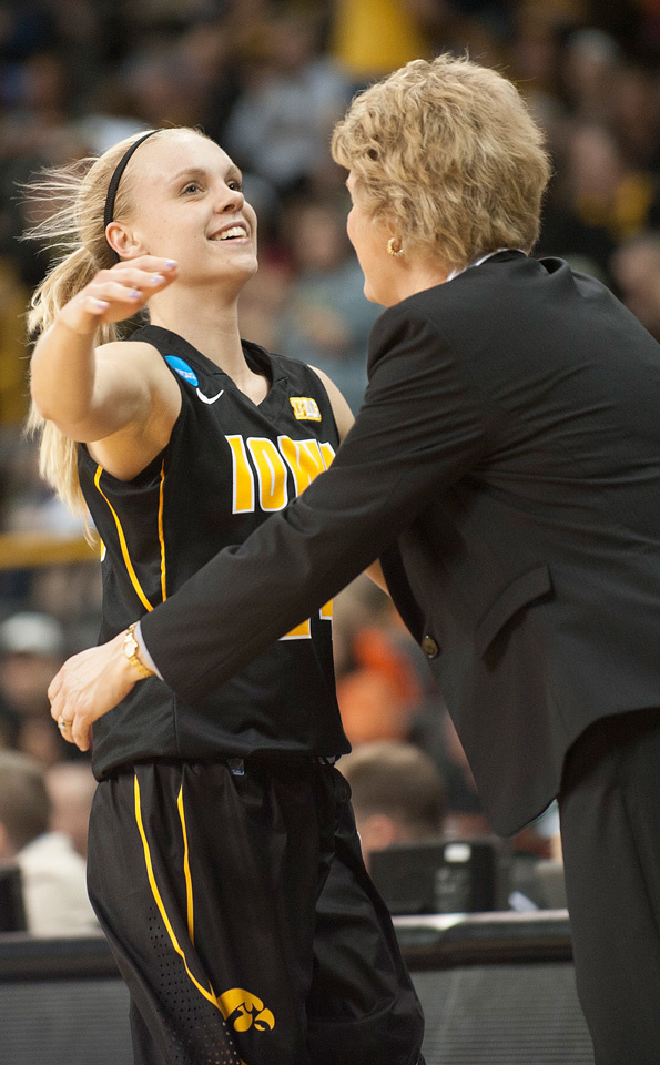 Jaime Printy gets a hug from Coach Lisa Bluder.