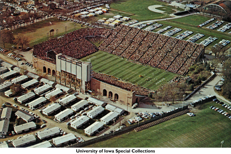 Aerial shot of temporary student housing barracks to the west of Iowa (now Kinnick) Stadium, 1963