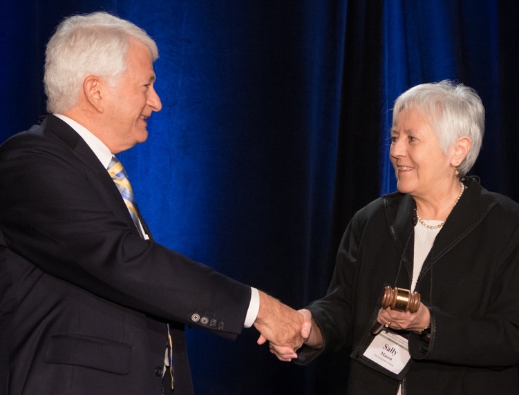 Outgoing A.P.L.U Board Chair Gene D. Block passes the gavel to UI President Sally Mason 