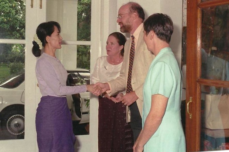 McMullen shaking hands with democracy leader Aung San Suu Kyi in Rangoon, Burma. 