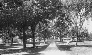 Historic photo looking toward Old Capitol from the east, with class boulders on either side of the path