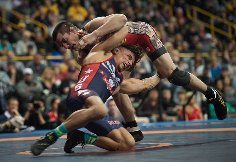 Former Iowa wrestler Brent Metcalf, who narrowly missed out on a spot on the 2012 Olympic Team, started his day Saturday with an unexpected loss to eventual weight class champion Frank Molinaro.