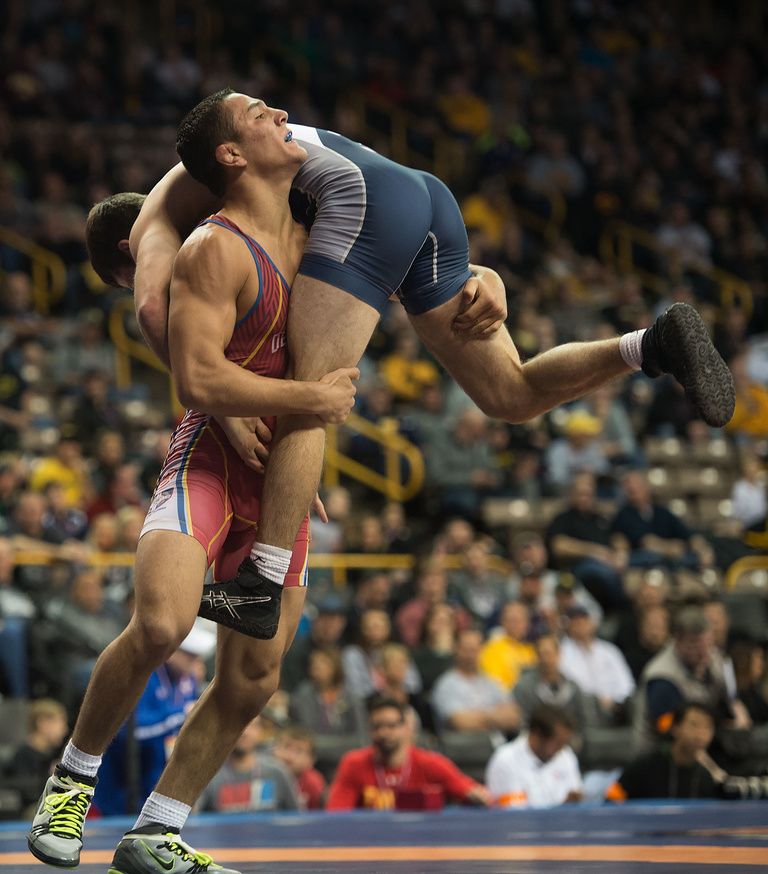 The high schooler who grabbed all the attention, however was Aaron Pico, above in red, shown here throwing Jayson Ness during their first round match. Pico was down 9-0 to Ness, one point away from elimination. He came back to win the match and then go al