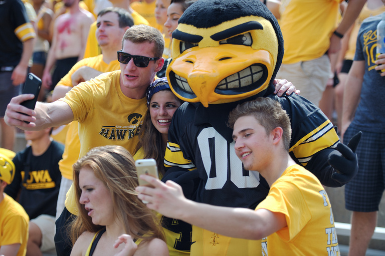 Herky poses with fans for photos.