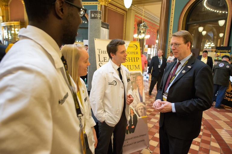 pharmacy students speaking with politician