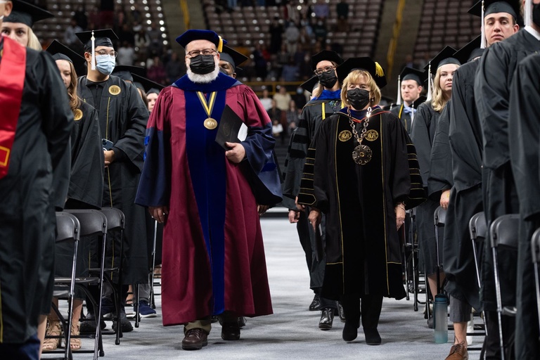 UI President Barbara Wilson and CLAS Associate Dean for the Arts and Humanities Roland Racevkis lead faculty during the opening procession of the commencement ceremony. Photo by Tim Schoon.