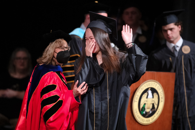 Tippie College of Business Dean Amy Kristof-Brown celebrates commencement with a student. Photo by Justin Torner.