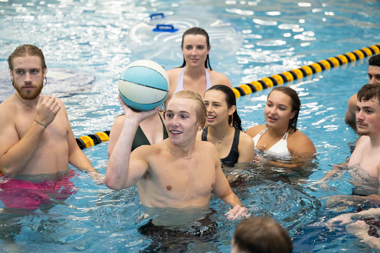 Students play games during open swim at the Campus Wellness and Recreation Center.