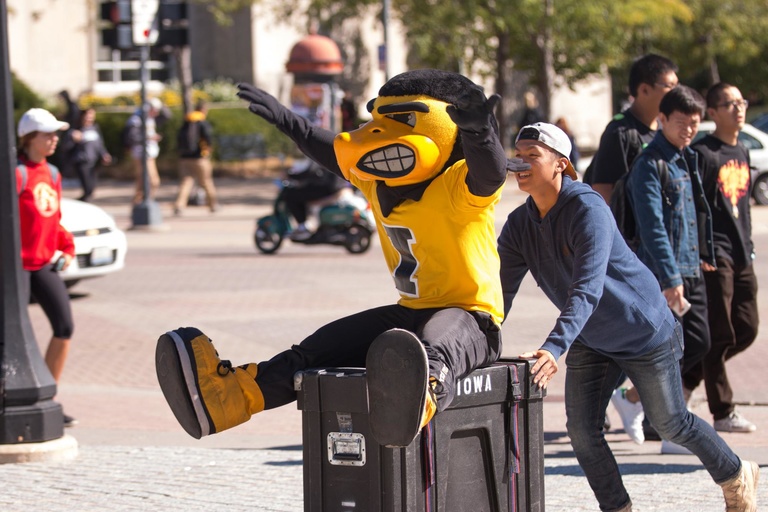 Herky "helps" the Pandelirium Steel Drum Band set up their instruments on the Pentacrest for the College of Liberal Arts & Sciences' We Are Phil celebration on Wednesday, September 30.