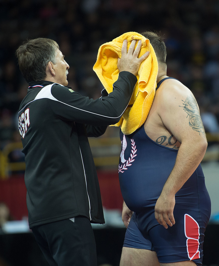 Crowd favorite Robby Smith, who wrestles 130 KG Greco-Roman, is toweled off in between periods. 