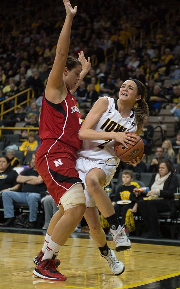 Ally Disterhoft draws contact in the paint.