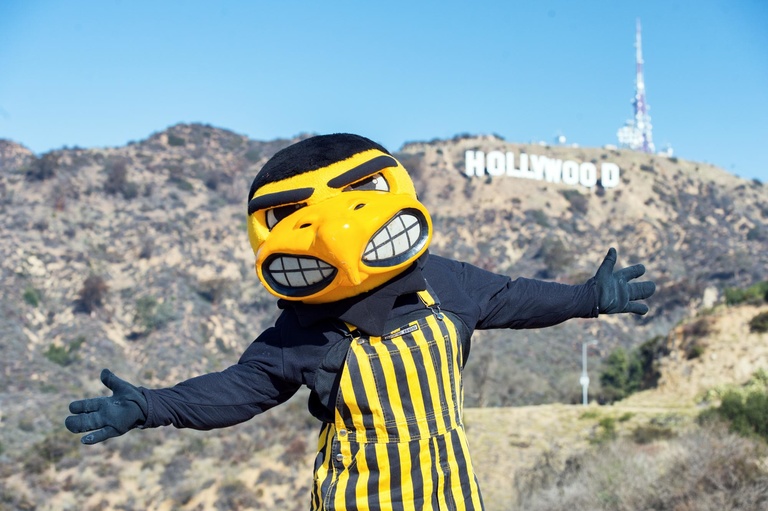 Herky in front of the Hollywood sign