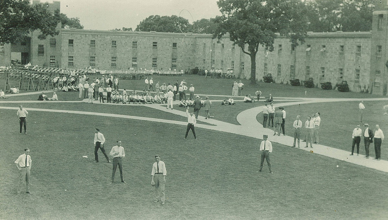 black-and-white photo of students hanging out in the Quadrangle courtyard