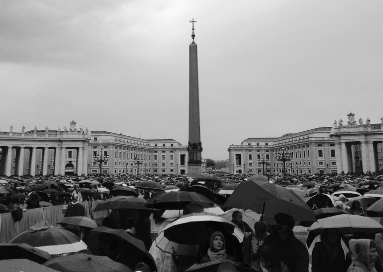 Crowd with umbrellas at Vatican City on a rainy Easter Sunday