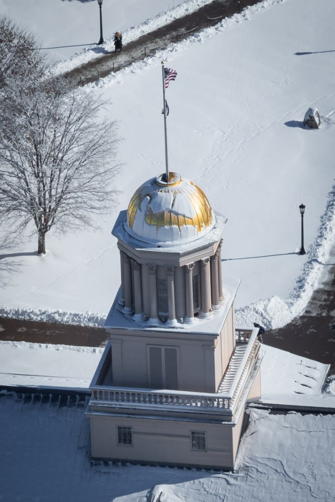 Aerial view of snow covered campus and Old Capitol Museum dome.