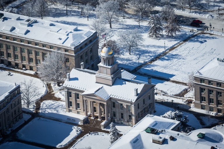 Aerial view of snow covered campus. 