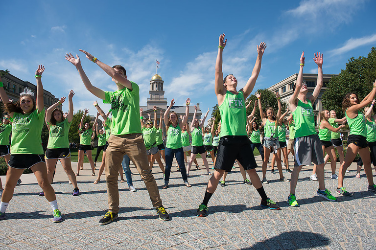 flash mob dancers in lime green attire