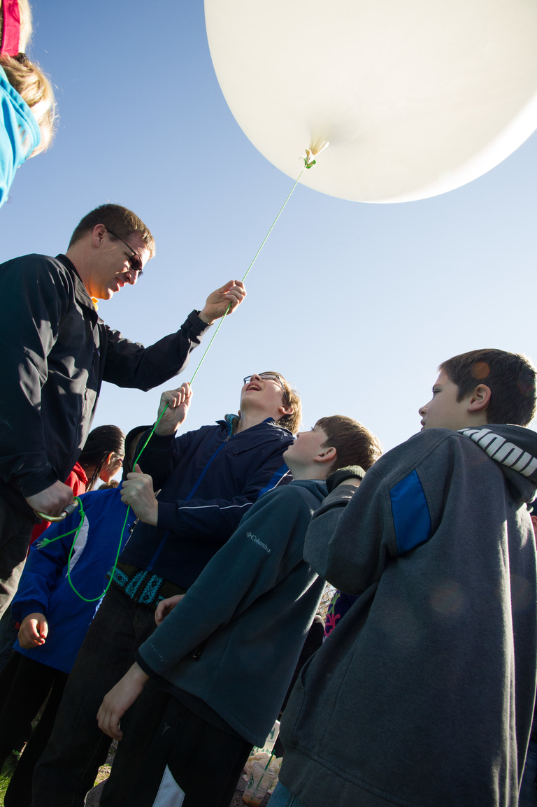 Science Education Professor Ted Neal launches a weather balloon with students in the community. 