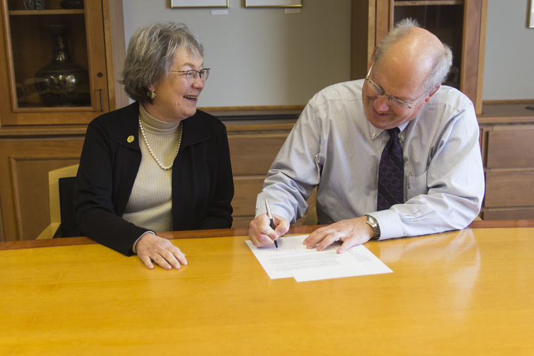 Cornell dean and UI Law dean siging the 3+3 agreement