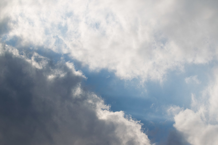 A line of blue sky peeks through cloud cover.