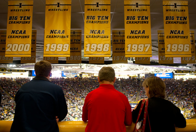 Iowa’s no stranger to championship wrestling, as evidenced by the banners hanging from the Carver-Hawkeye Arena rafters.