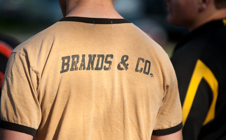 A fan’s shirt gives a shout-out to Iowa head coach Tom Brands and the Iowa Hawkeyes.