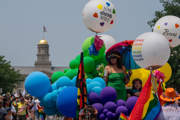 A bright and colorful float is the center of attention during the Iowa City Pride Parade.