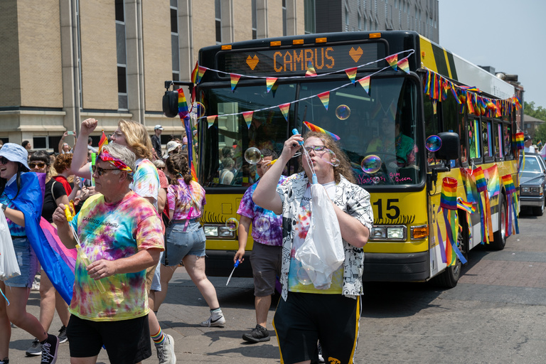 Cambus celebrates pride with bubbles during the Iowa City Pride Parade and Festival.