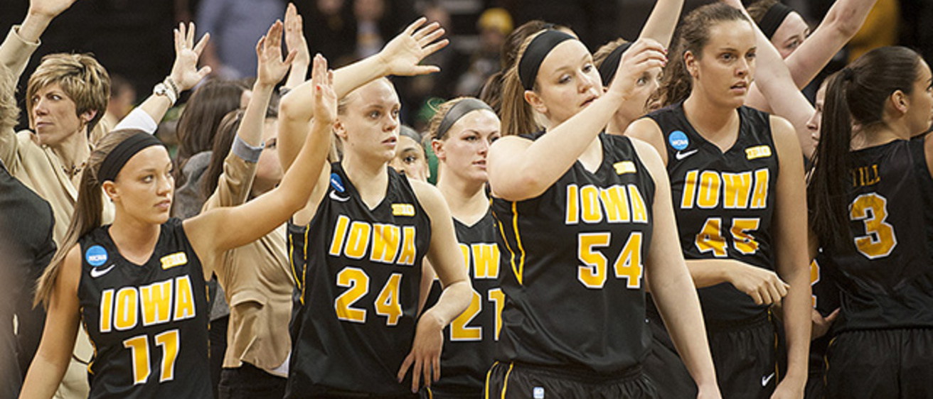 Iowa women's basketball team waves to the crowd after the game